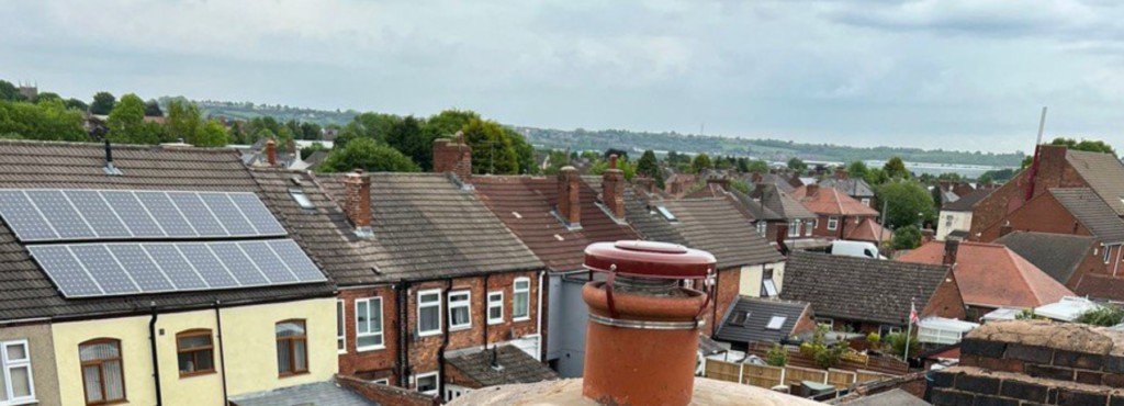 This is a photo taken from a roof which is being repaired by LS Roofing Beaconsfield, it shows a street of houses, and their roofs
