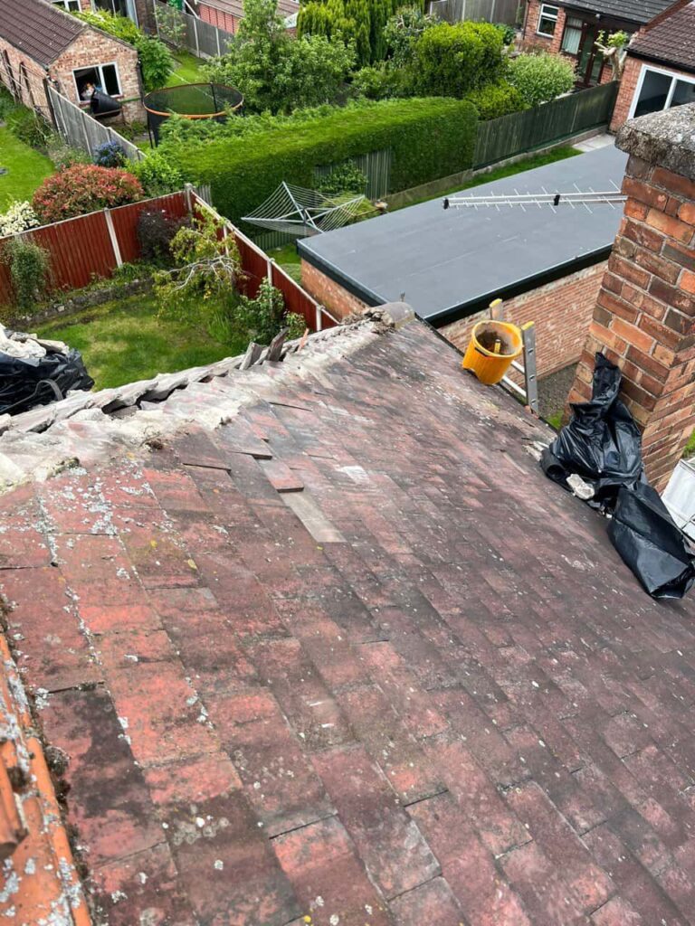 This is a photo of a roof where the hip tiles have been removed, and are just about to be replaced. Works carried out by LS Roofing Beaconsfield